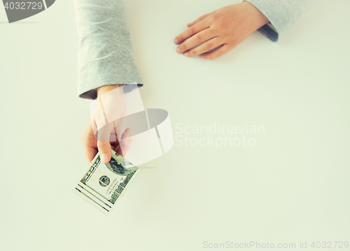 Image of close up of woman hands holding us dollar money