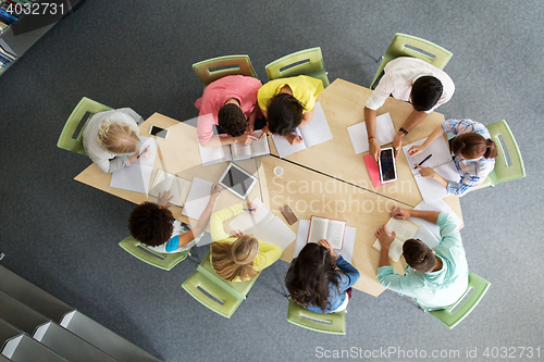 Image of group of students with tablet pc at school library