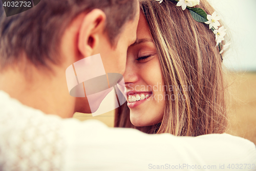 Image of happy smiling young hippie couple outdoors