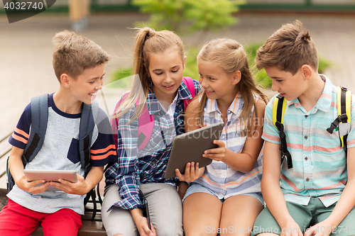 Image of group of happy elementary school students talking