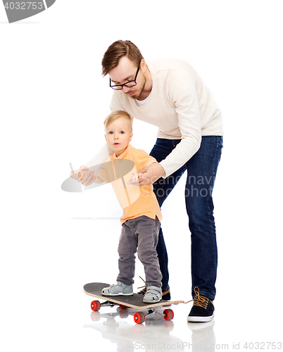 Image of happy father and little son on skateboard