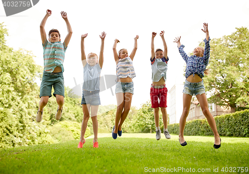 Image of happy kids jumping and having fun in summer park