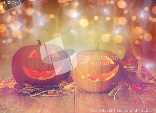 Image of close up of carved halloween pumpkins on table