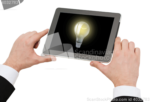 Image of close up of man hands holding tablet pc