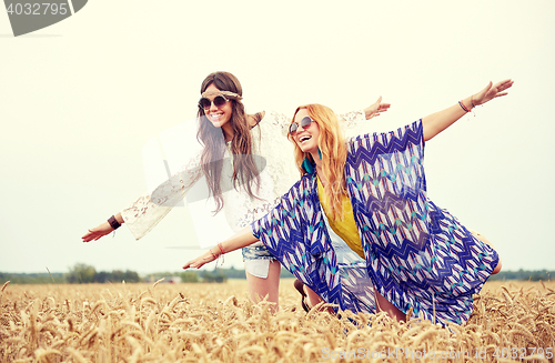 Image of happy hippie women having fun on cereal field