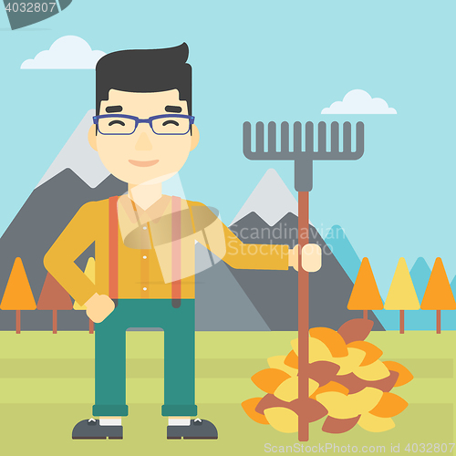 Image of Man raking autumn leaves vector illustration.