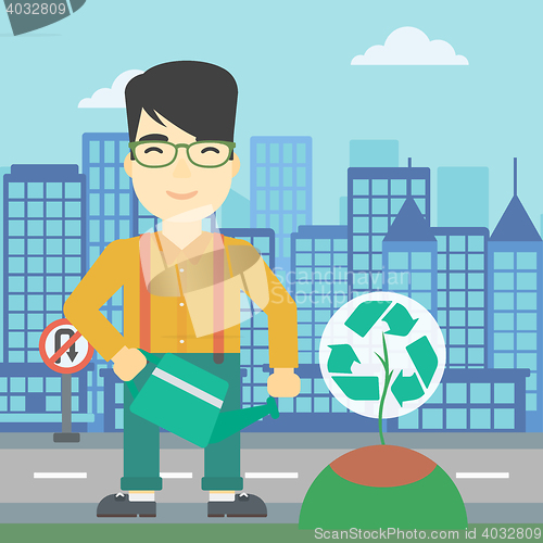 Image of Man watering tree with recycle sign.