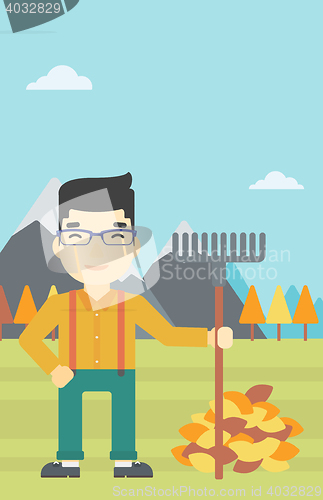 Image of Man raking autumn leaves vector illustration.