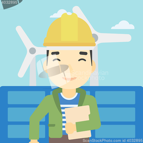 Image of Male worker of solar power plant and wind farm.