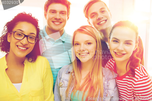 Image of group of smiling people at school or home