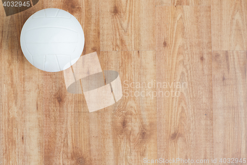 Image of close up of volleyball ball on wooden floor