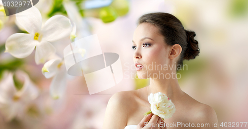 Image of beautiful asian woman with flower and jewelry