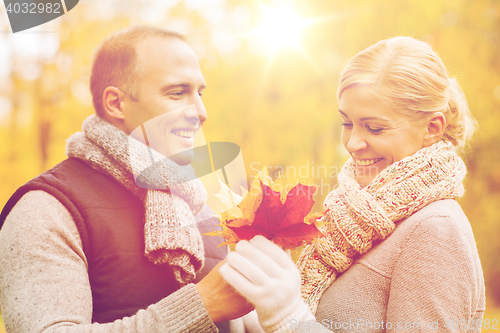 Image of smiling couple in autumn park