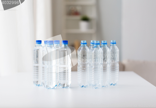 Image of close up of bottles with drinking water on table