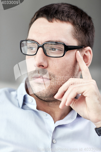 Image of portrait of  businessman in eyeglasses at office