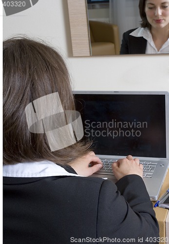 Image of working businesswoman