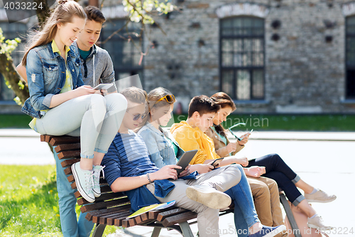 Image of group of students with tablet pc at school yard