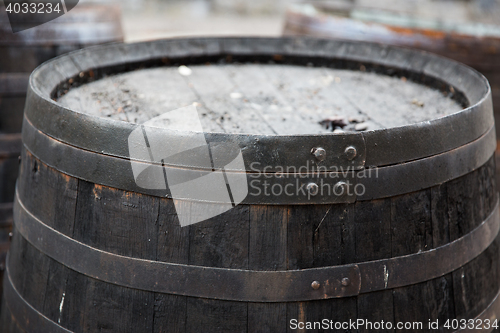 Image of close up of old wooden barrel outdoors