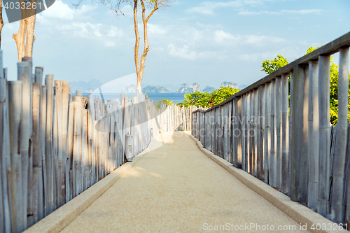 Image of road with fence at seaside