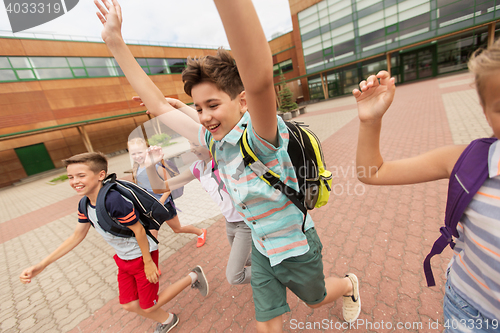 Image of group of happy elementary school students running