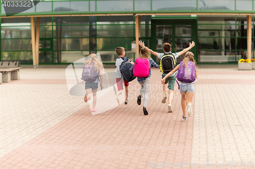 Image of group of happy elementary school students running