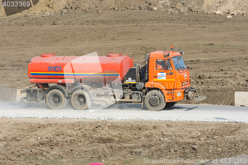 Image of Taman, Russia - March 8, 2016: Tanker traveling on a dirt road from the gravel. Taman, Russia