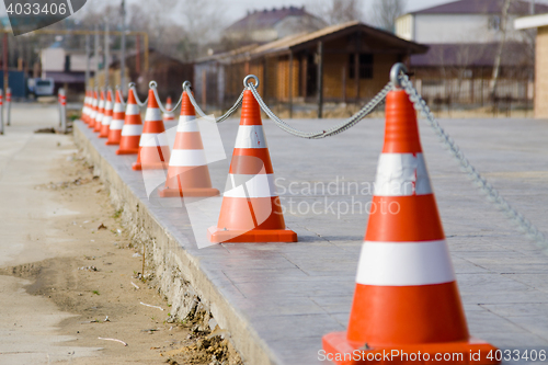 Image of Fencing the territory of the plastic cones connected by a chain