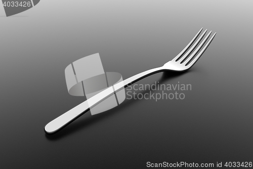 Image of Silver fork on grey background