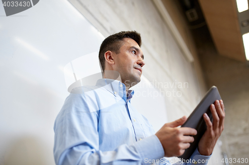 Image of teacher or lector with tablet pc at lecture