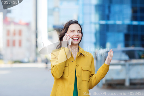 Image of smiling young woman or girl calling on smartphone