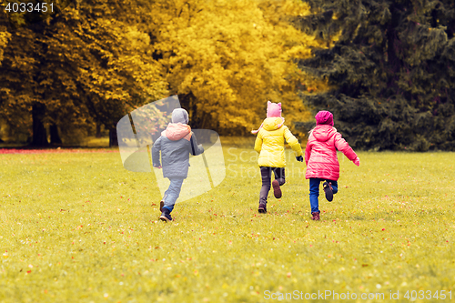 Image of group of happy little kids running outdoors