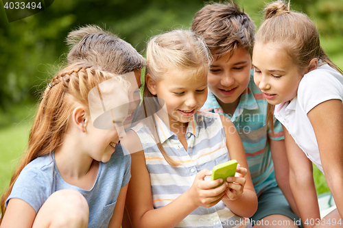 Image of kids or friends with smartphone in summer park