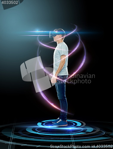 Image of happy man in virtual reality headset or 3d glasses