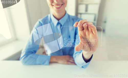 Image of close up of woman with transparent smartphone