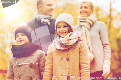 Image of happy family in autumn park