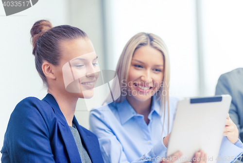 Image of business team with tablet pc having discussion