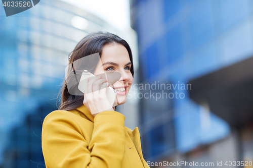 Image of smiling young woman or girl calling on smartphone