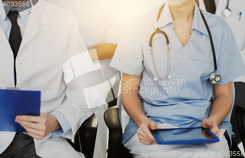 Image of close up of happy doctors at seminar or hospital