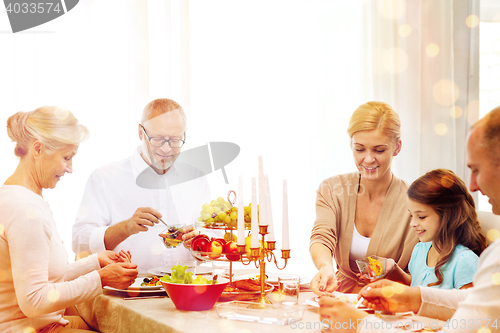 Image of smiling family having holiday dinner at home