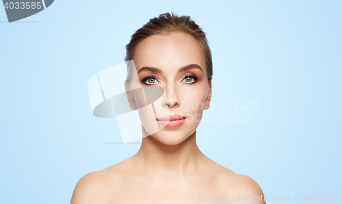 Image of beautiful young woman face over white background