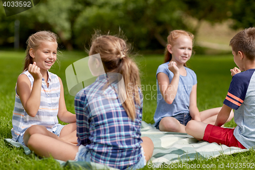Image of happy kids playing rock-paper-scissors game