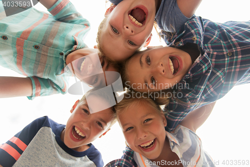 Image of group of happy children faces in circle