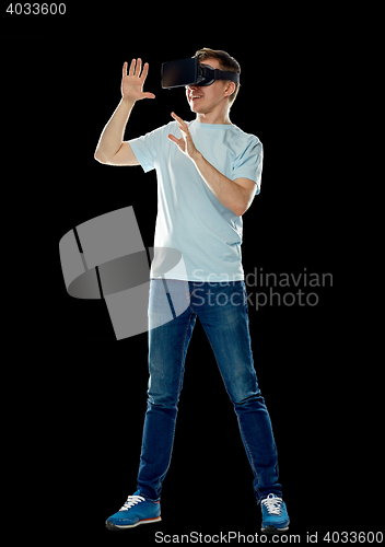 Image of happy man in virtual reality headset or 3d glasses