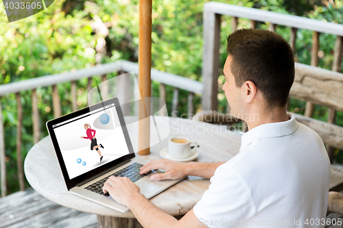 Image of man with fitness app on laptop screen