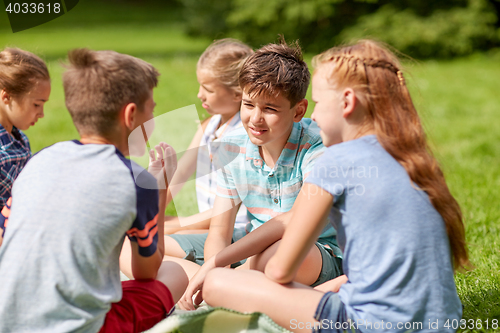 Image of group of happy kids or friends outdoors