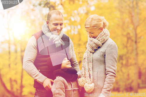 Image of happy family in autumn park