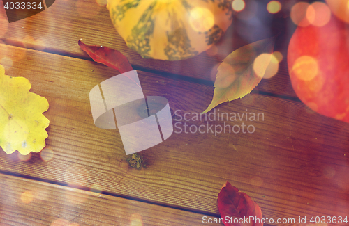 Image of close up of pumpkins on wooden table at home