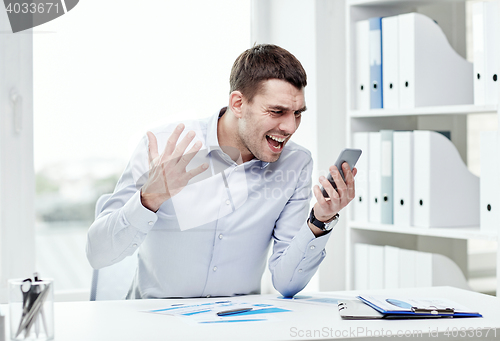 Image of close up of businessman with smartphone