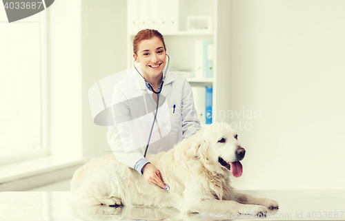 Image of happy woman with dog and doctor at vet clinic