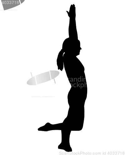 Image of Silhouette of woman doing yoga